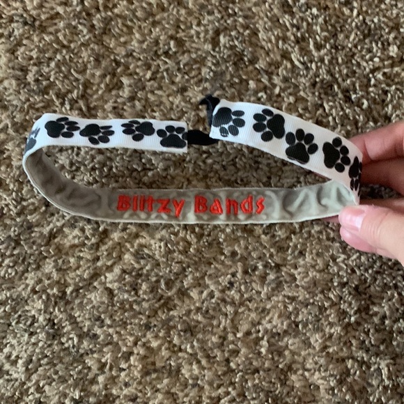 White stretchy headband with black paw prints - Picture 2 of 2